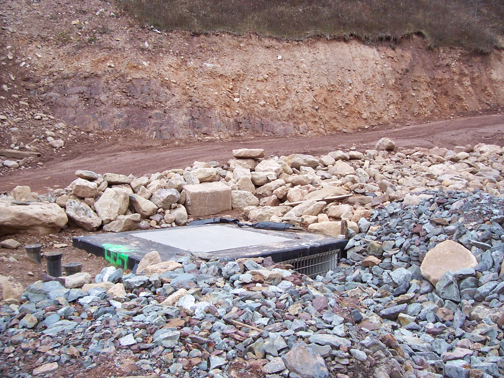 11 21 05  intake concrete distribution chamber showing rip rap lined overflow channel