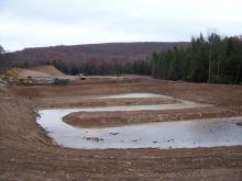 11 09 05 view of 2nd settling pond with berms that will be below water level when full