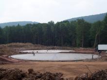 7 19 05 pouring concrete for base of limestone tanks2