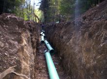 Laying pipeline water from discharge to treatment site